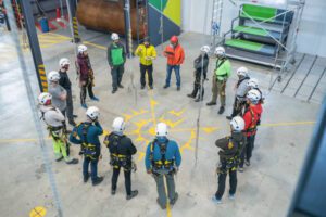 Construction team standing in a circle for a training