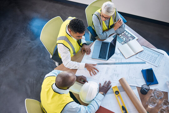 Construction team sitting around a table using a decision-making framework