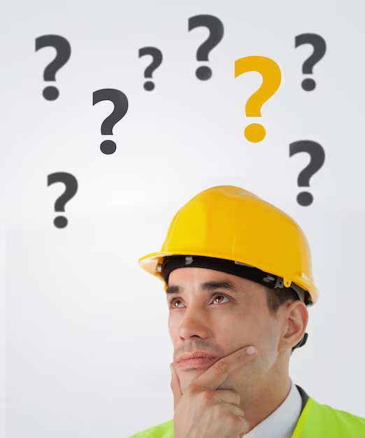man wearing hard hat with question marks floating over his head